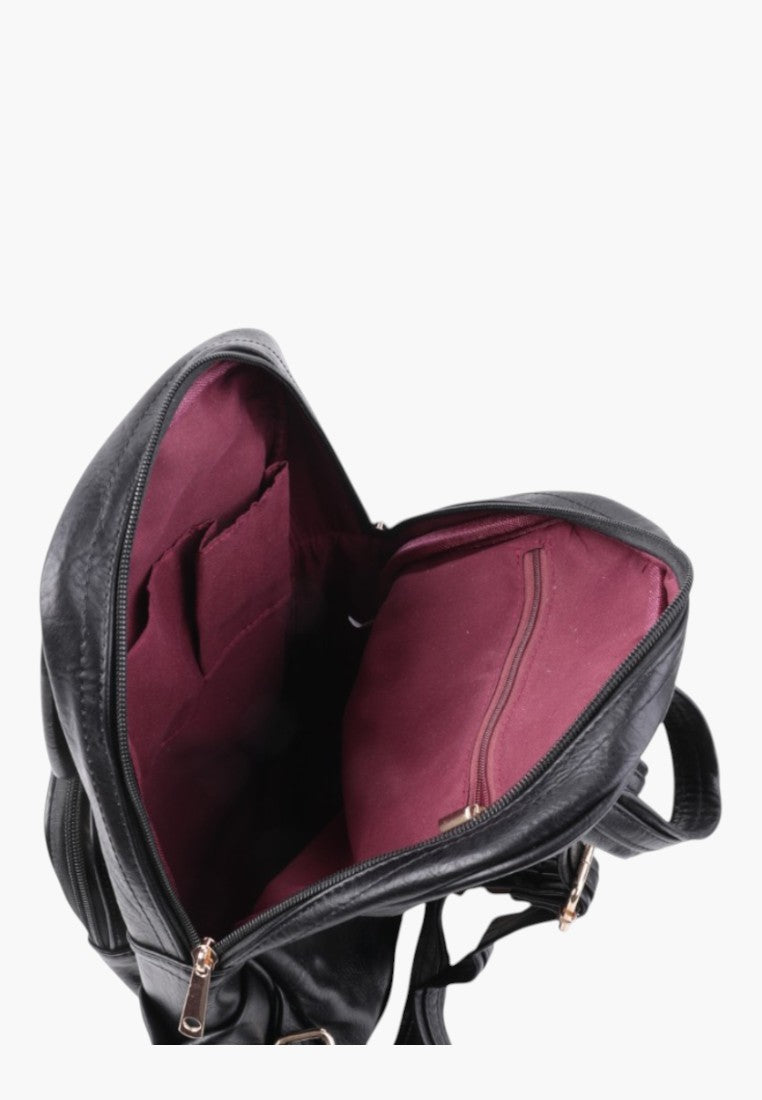 Falio black faux leather urban backpack with open main compartment showing burgundy lining and internal pockets