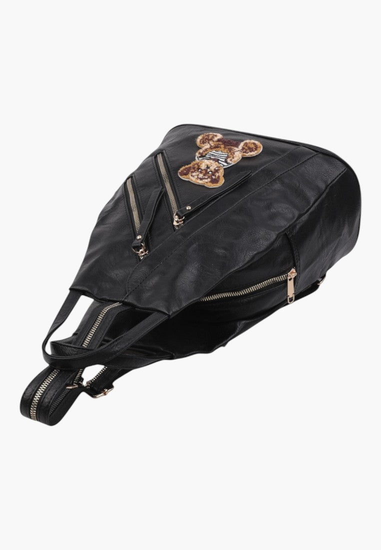 Falio black faux leather urban backpack with a decorative bear patch and multiple zippered pockets