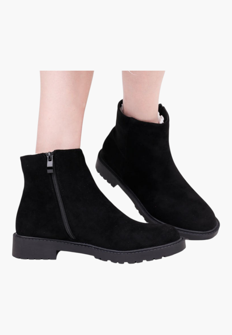 Falio black faux suede ankle boots with side zipper, round toe, and flat lug sole for winter wear.