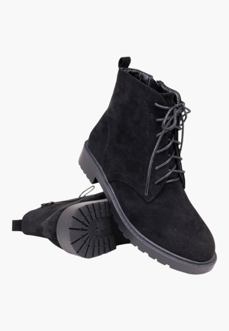 Falio black faux suede ankle boots with flat lug soles, side zipper, and front lace-up closure.