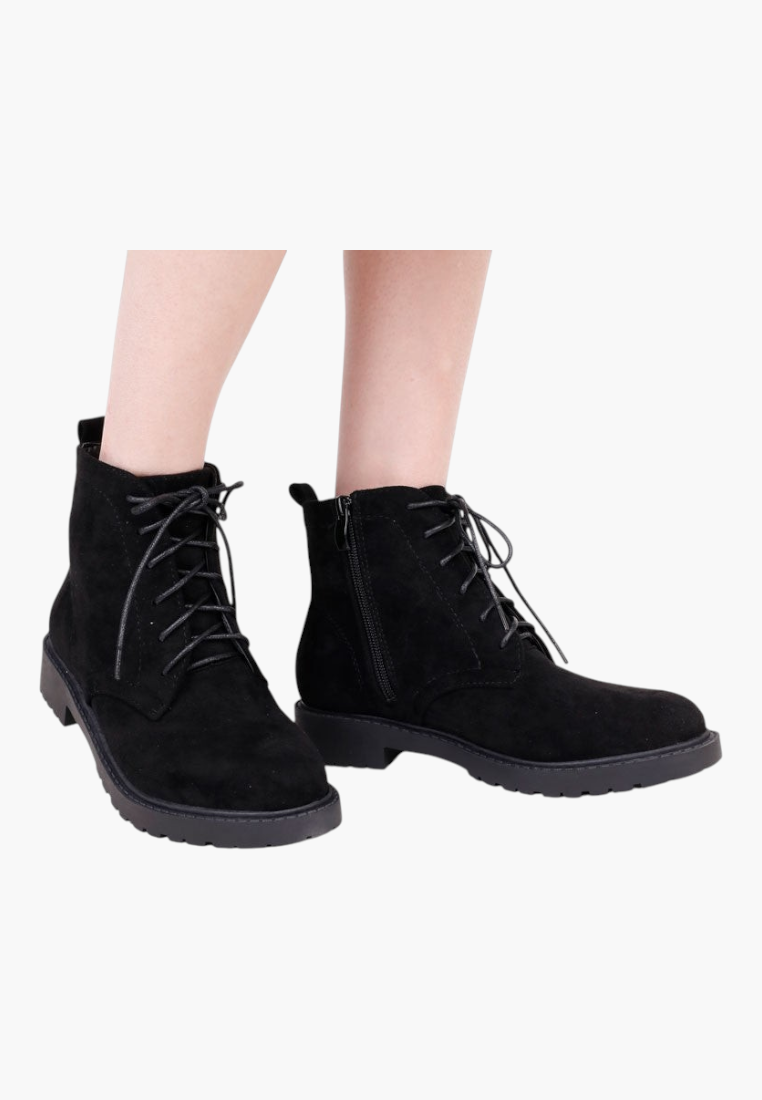 Falio black faux suede ankle boots with lace-up front, side zipper, and flat lug sole for women