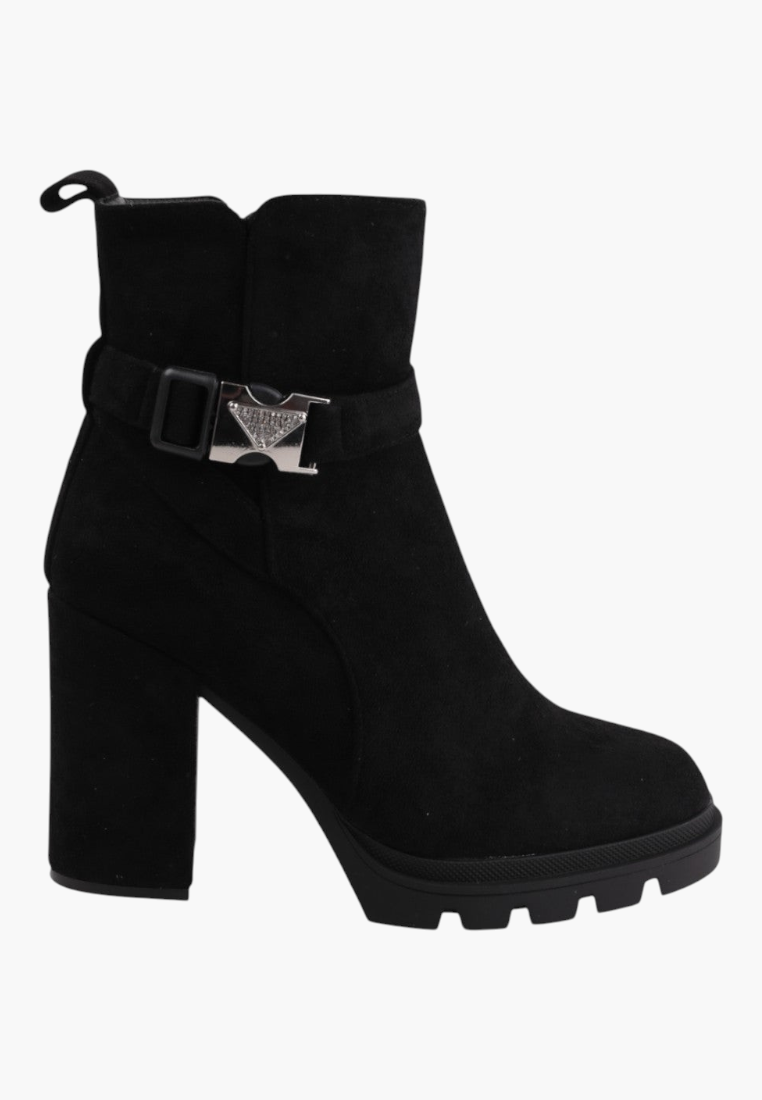 Falio black faux suede ankle boots with a chunky block heel, lug sole, and decorative silver buckle strap detail.