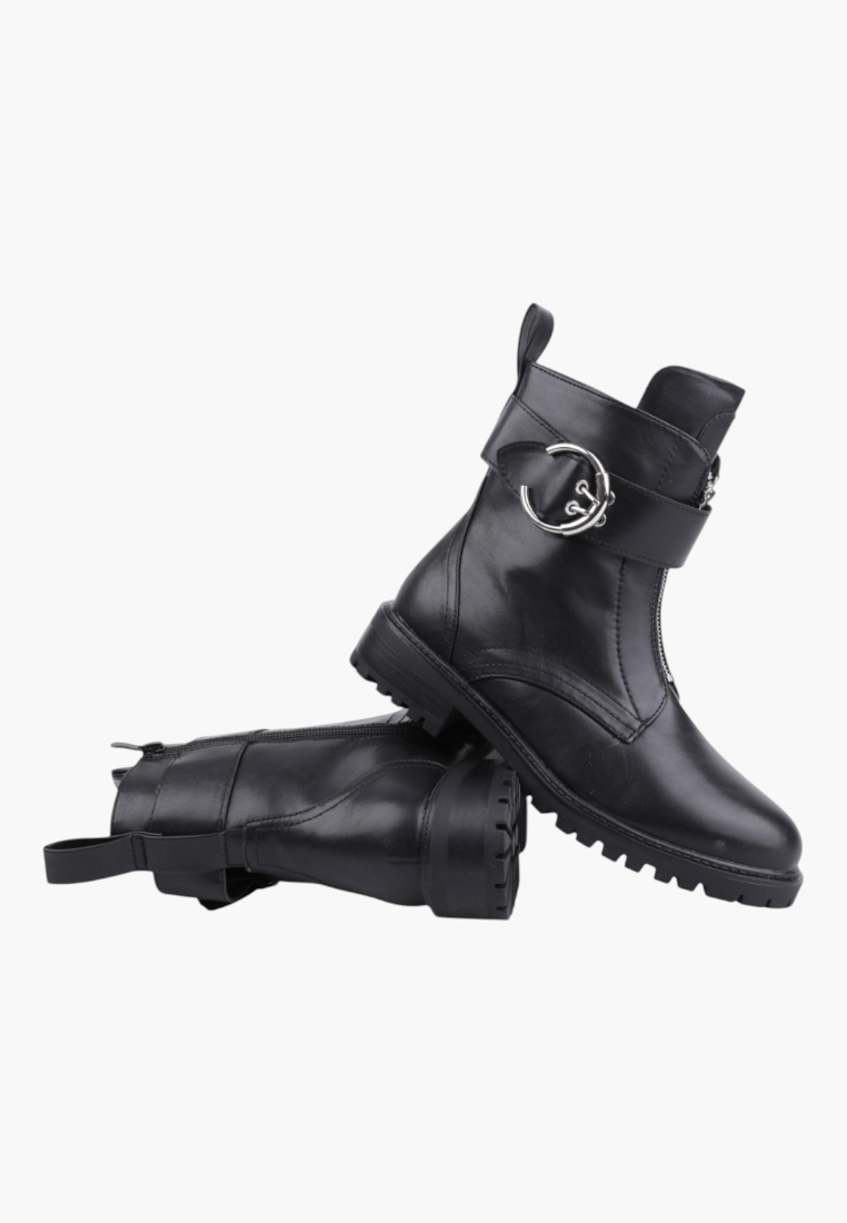 Falio black leather ankle boots with a silver buckle strap and front zipper, featuring a chunky lug sole.