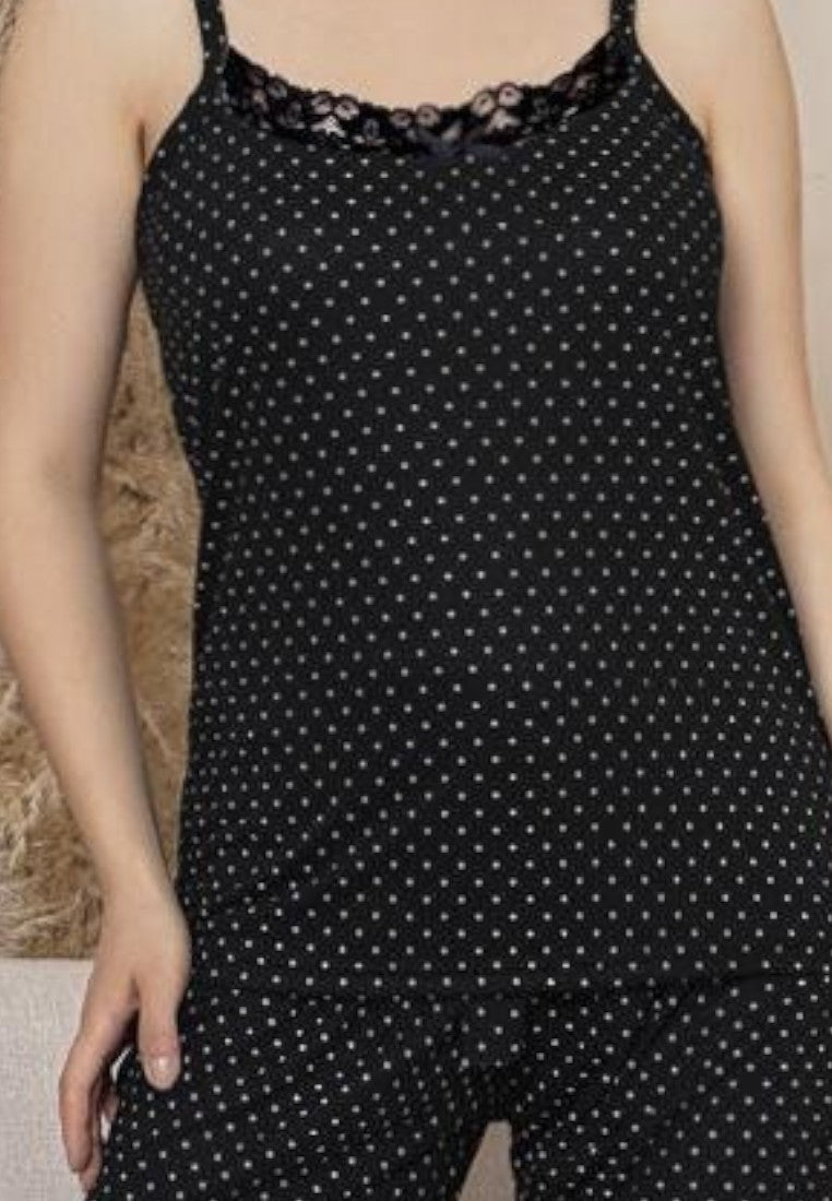 Falio black cotton pajama set with white polka dots, featuring a camisole top with lace trim and matching shorts.