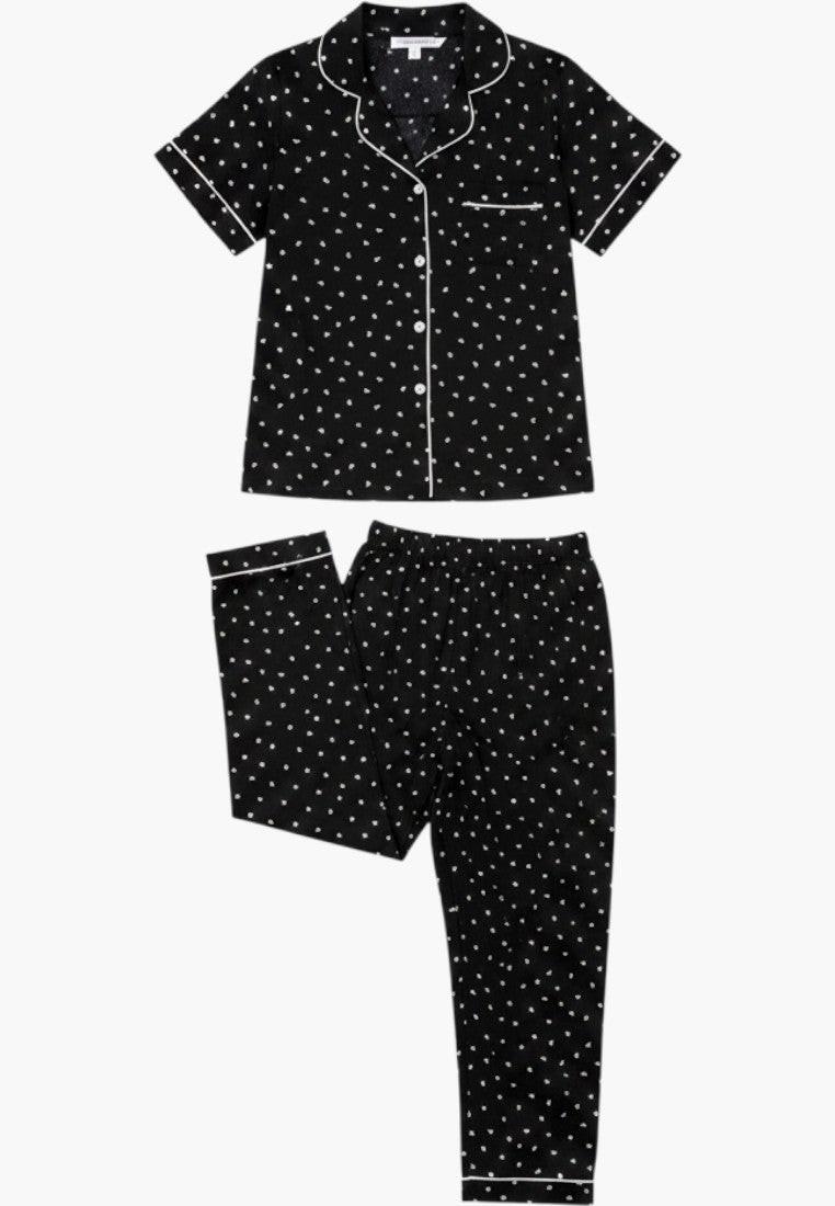 Falio women's black cotton pajama set with white polka dots, short sleeves, and 3/4 length pants.