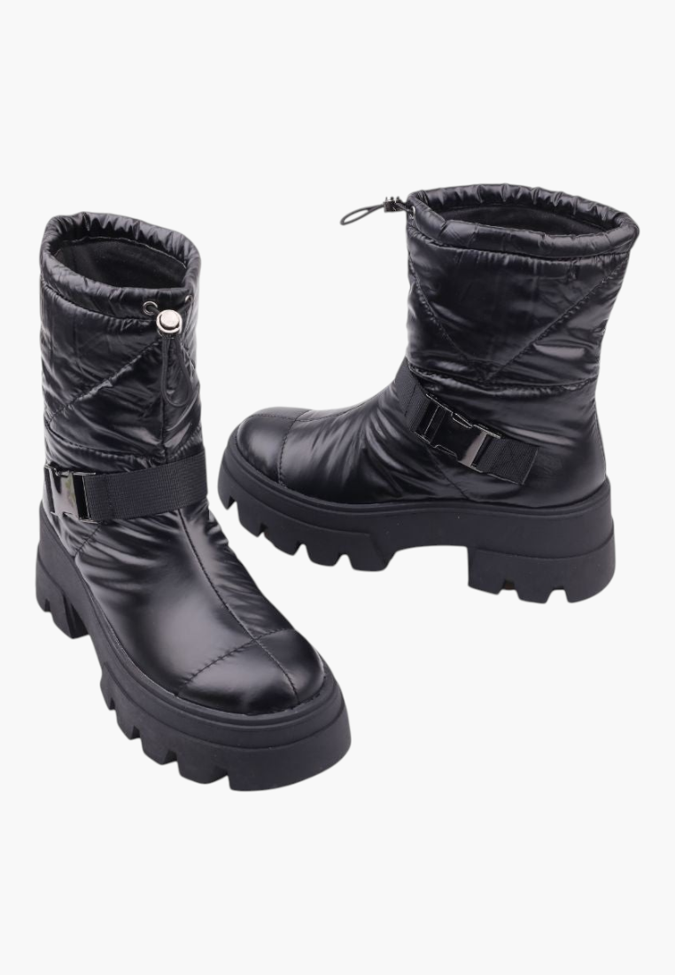 Falio black quilted textile snow boots with thick lug soles, ankle strap detail, and drawstring top closure.