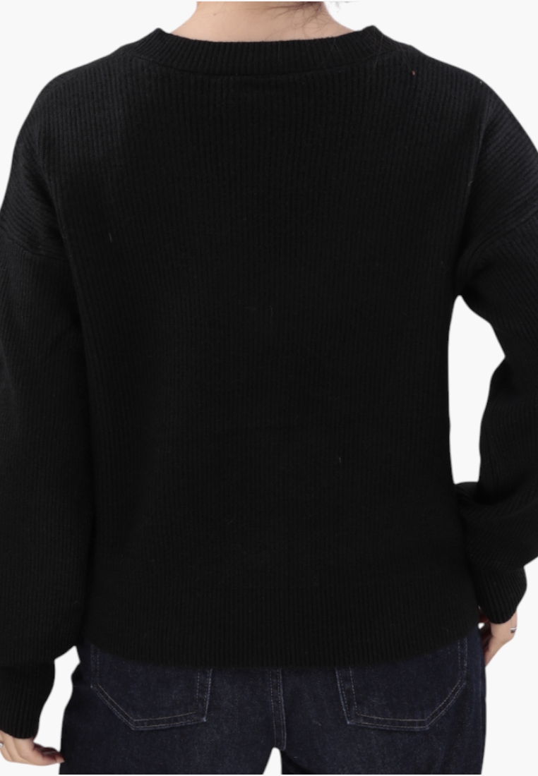 Falio black long-sleeve ribbed knit sweater worn by a model, back view showing hip-length fit