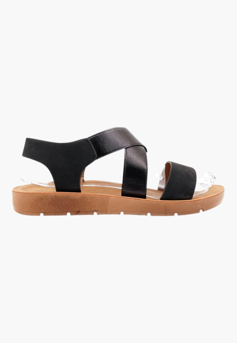 Falio black slip-on sandals with crossover straps, open toe, and thick tan sole for women