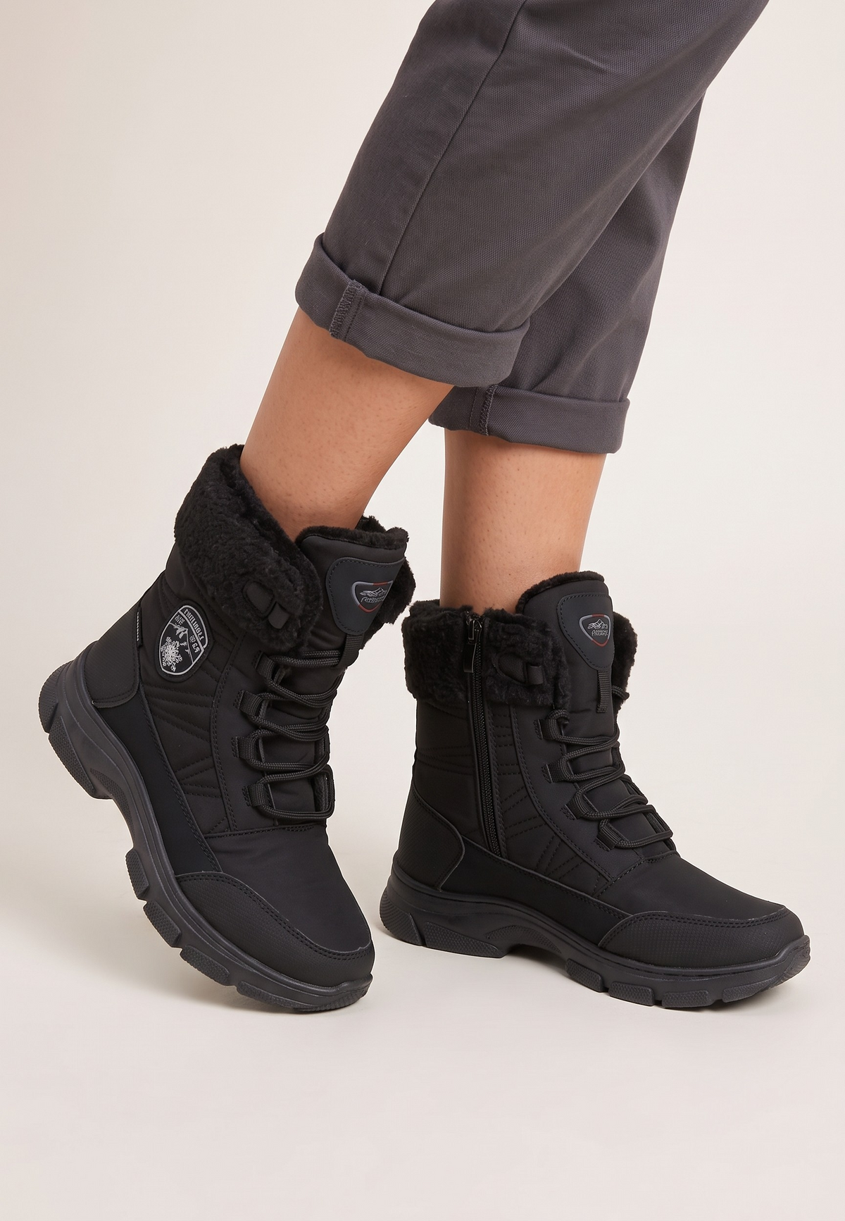 Falio black softshell women's snow boots with side zipper, lace-up front, and warm fleece-lined collar for winter.