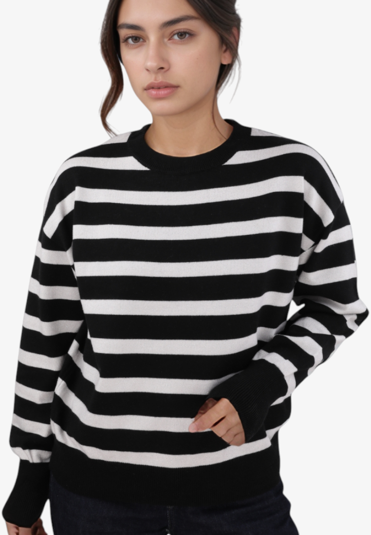 Model wearing a Falio black and white striped regular fit sweater with a round neckline and long sleeves.