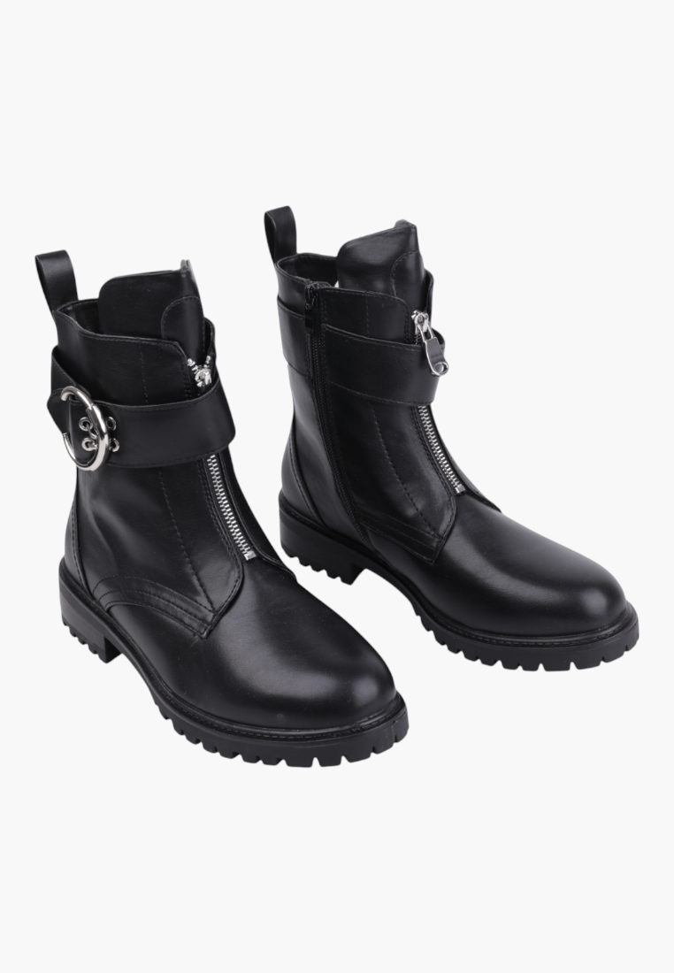 Falio black ankle boots with front zipper, buckle strap detail, and chunky lug sole for autumn and winter wear.