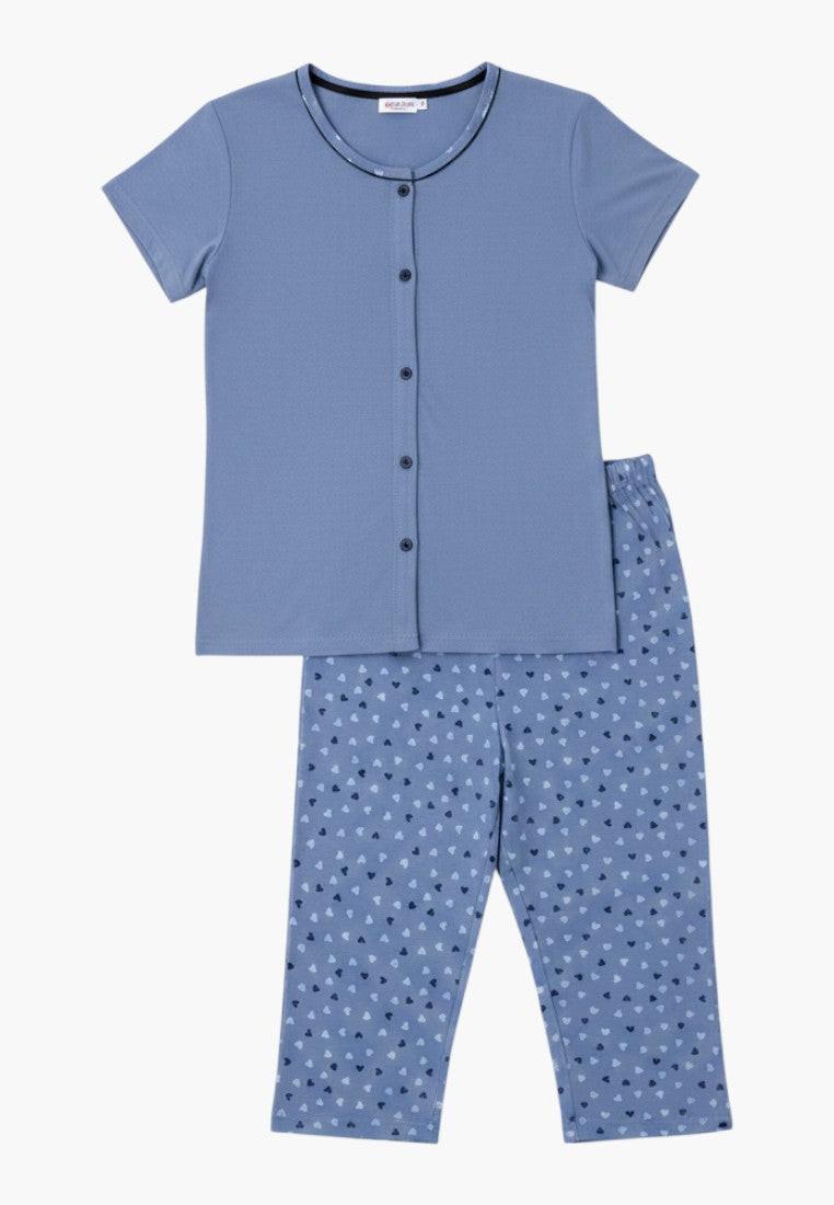 Falio blue cotton women's pajama set with short sleeves, button-up top, and 3/4 length heart-print pants.