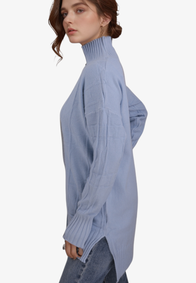Falio plus size blue mock neck sweater with long sleeves and ribbed cuffs worn by a woman, side view