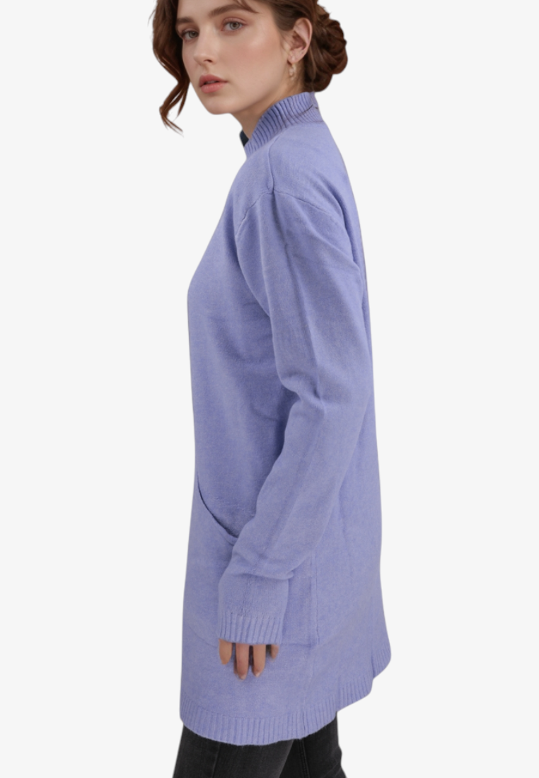 Falio blue plus size wool blend sweater with a mock neck and long sleeves worn by a model in a side profile view