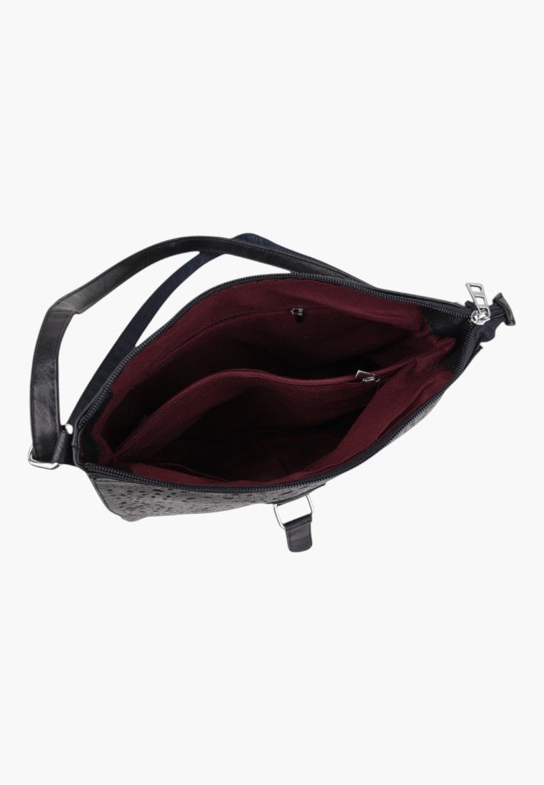 Falio blue crossbody bag with a textured exterior and a deep burgundy interior lining, shown from an open top view.