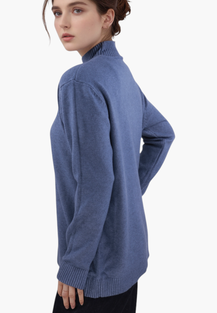 Falio blue viscose sweater with a mock neck and long sleeves worn by a woman, side view