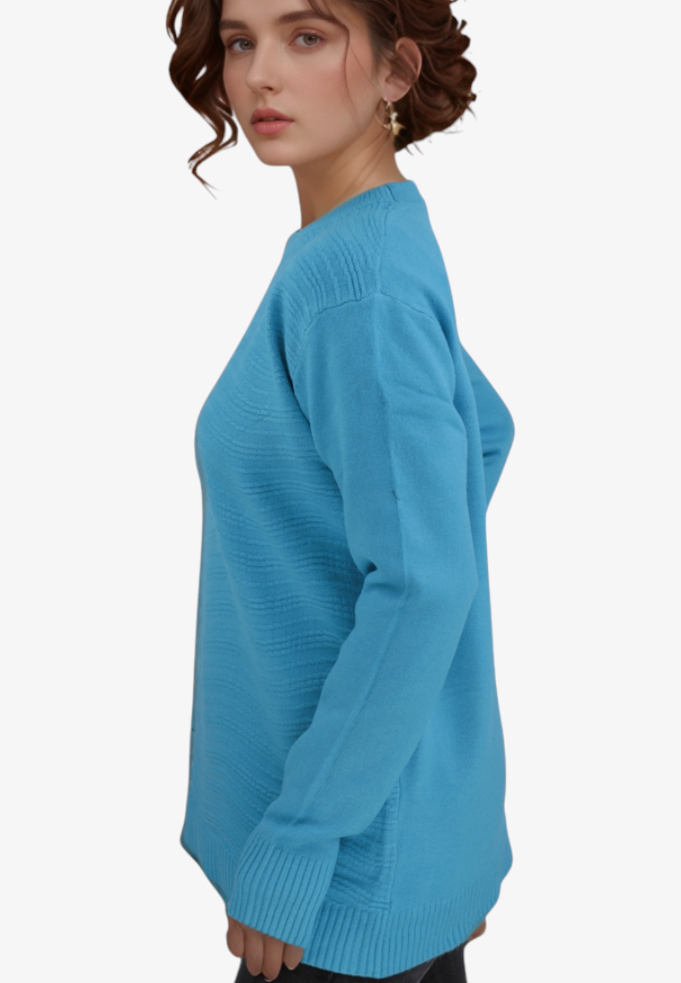 Model wearing a Falio blue wool and cashmere blend sweater with a round neckline and ribbed hem, side view