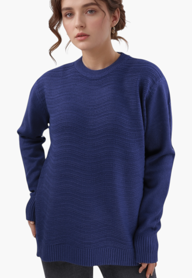 Model wearing a blue Falio wool and cashmere blend sweater with a round neckline and textured wavy knit pattern