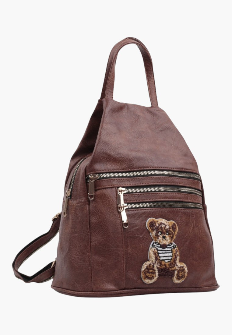 Falio small brown faux leather city backpack with multiple zippered pockets and a cute teddy bear patch