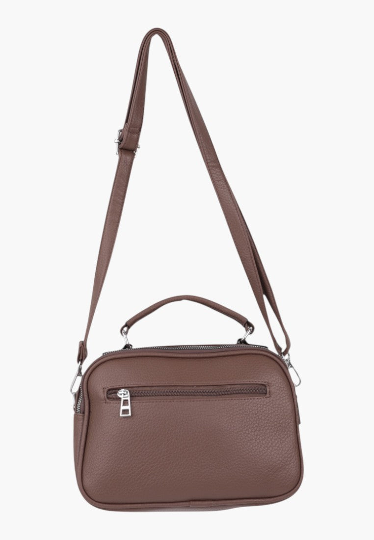 Falio brown faux leather crossbody bag with top handle, zipper closure, and multiple pockets for daily organization.