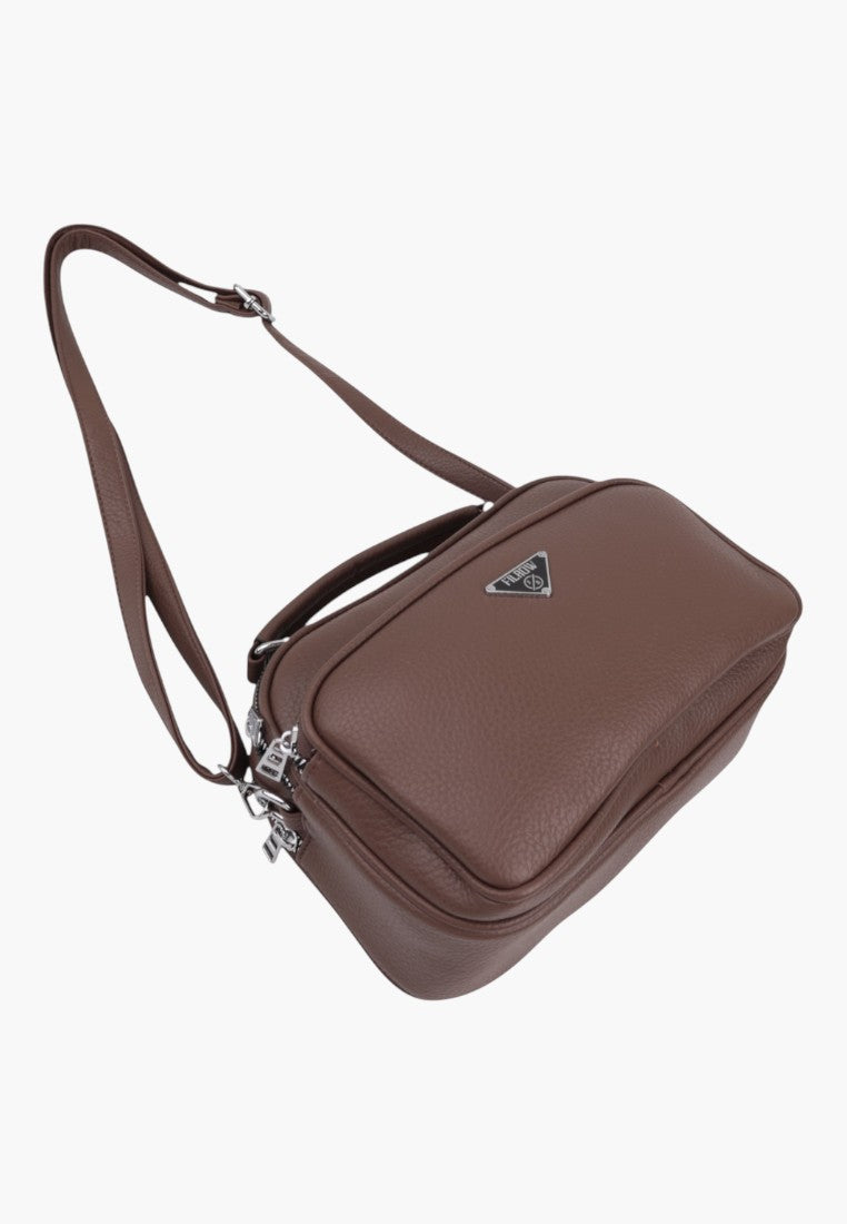 Falio brown faux leather crossbody bag with multiple compartments, silver hardware, and adjustable shoulder strap.