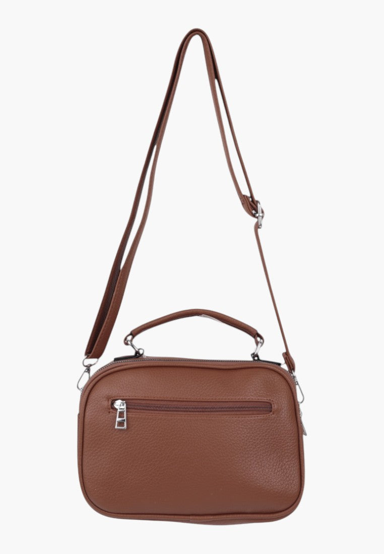 Falio brown faux leather crossbody bag with a top handle, adjustable shoulder strap, and front zipper pocket.