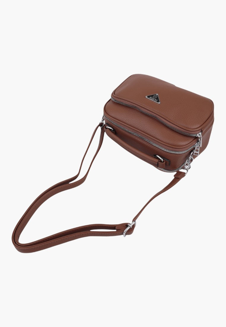 Falio brown faux leather crossbody bag with multiple zippered compartments and an adjustable shoulder strap.