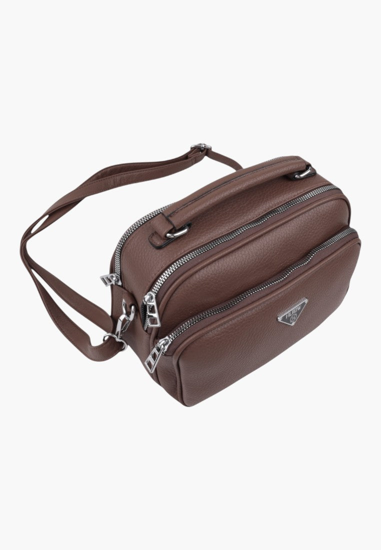 Falio brown faux leather crossbody bag with multiple zippered compartments and silver hardware details.