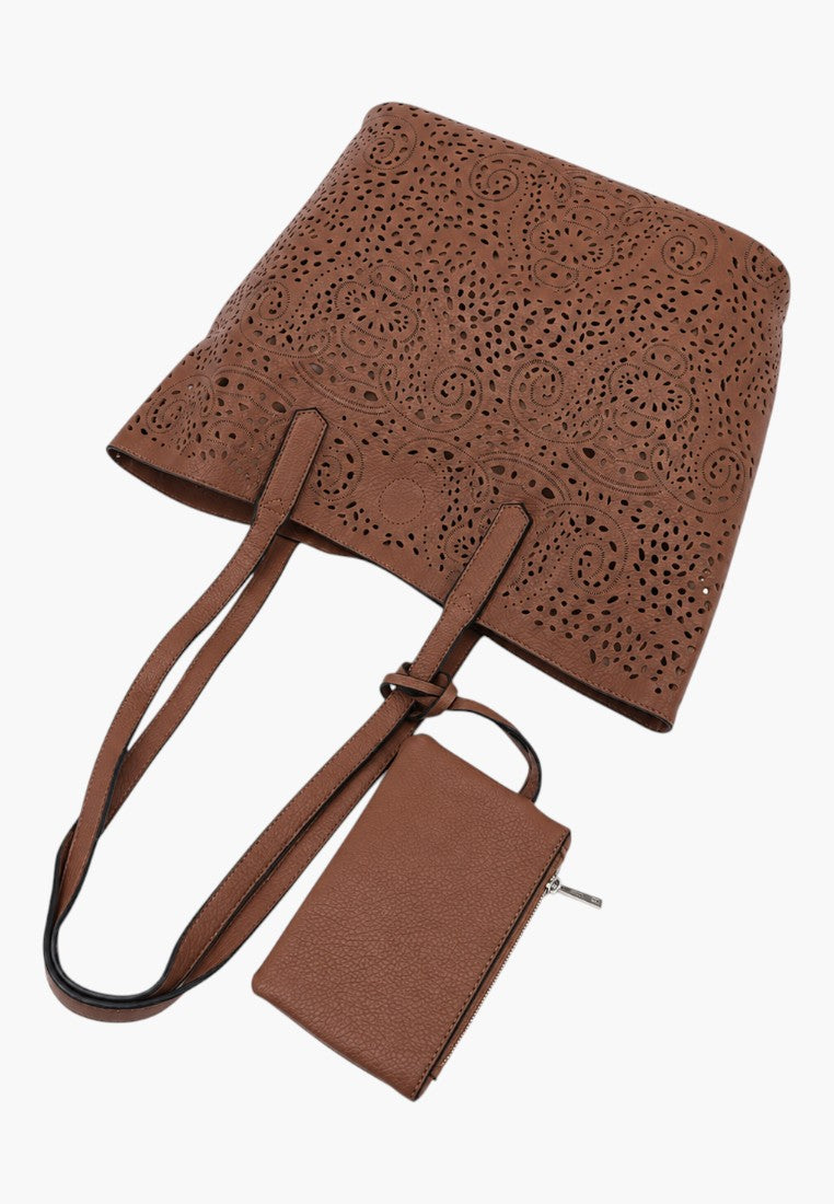 Falio brown faux leather shopper bag with intricate laser-cut floral patterns and a matching small zippered pouch