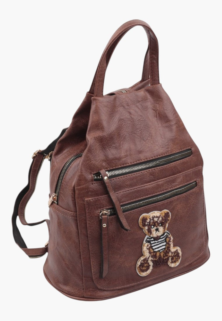 Falio brown faux leather urban backpack with a cute teddy bear patch and multiple zippered pockets