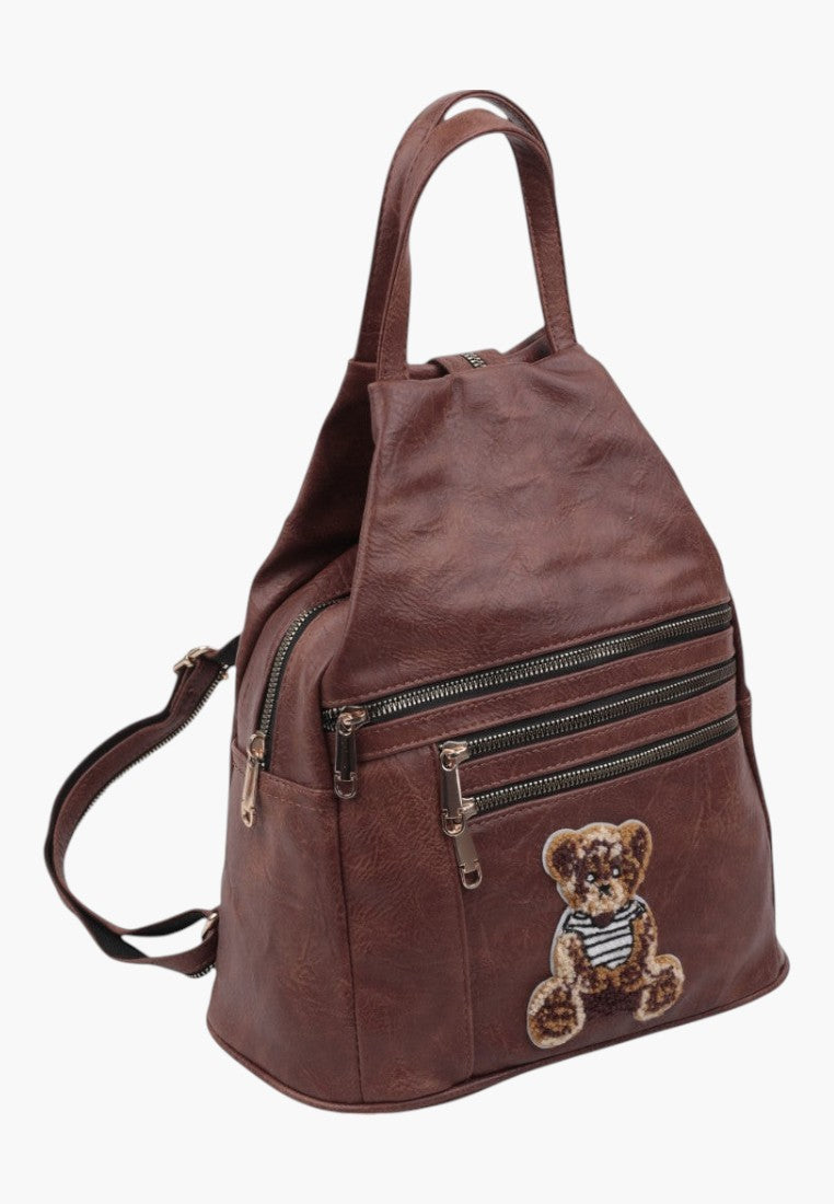 Falio small brown faux leather city backpack with a cute teddy bear patch and multiple zippered pockets