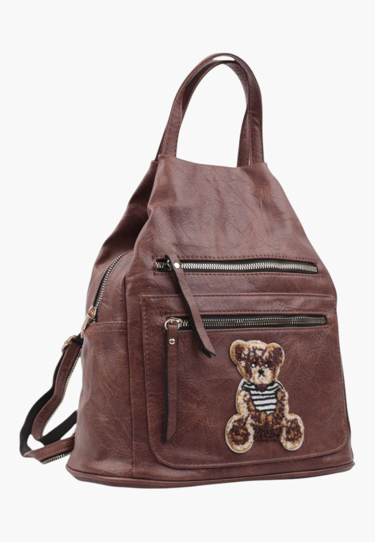 Falio brown faux leather urban backpack with a cute teddy bear patch and multiple zippered pockets