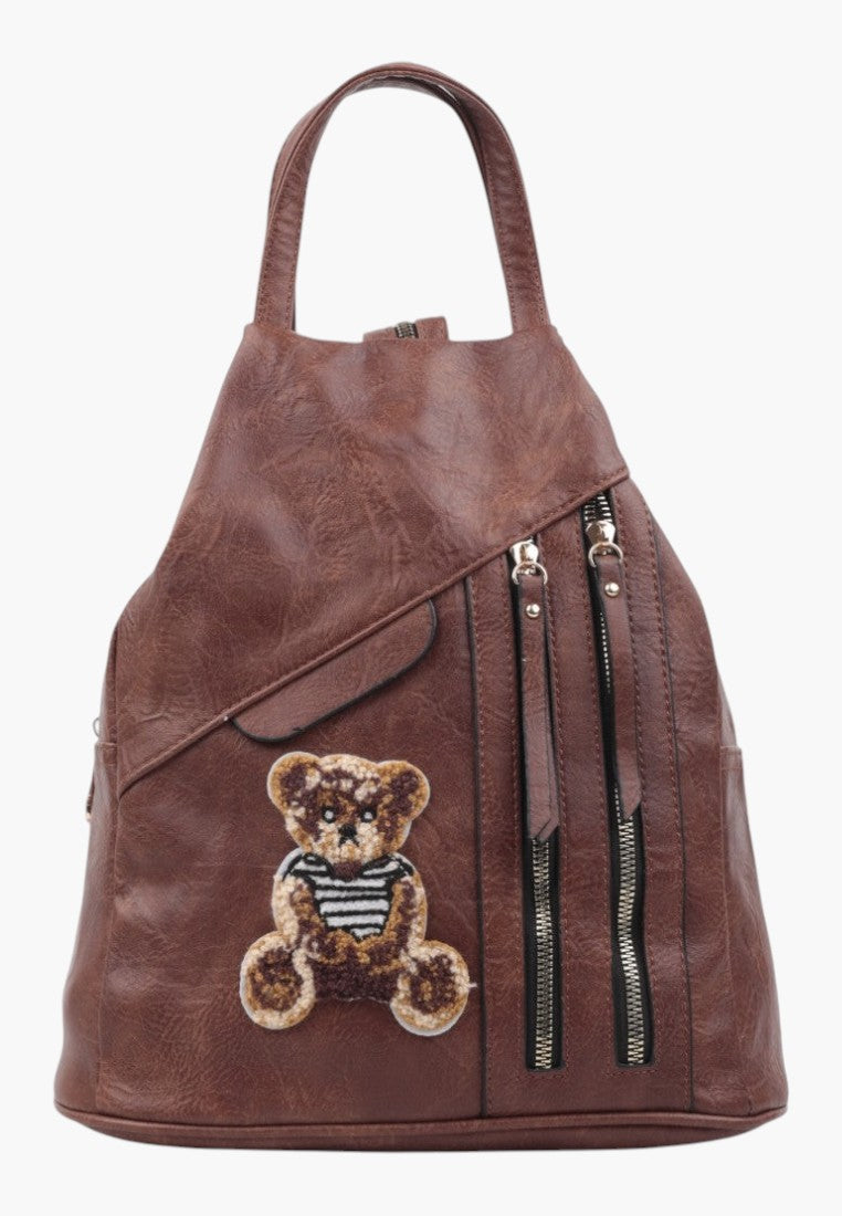 Falio brown faux leather urban backpack with a cute teddy bear patch and multiple zippered pockets