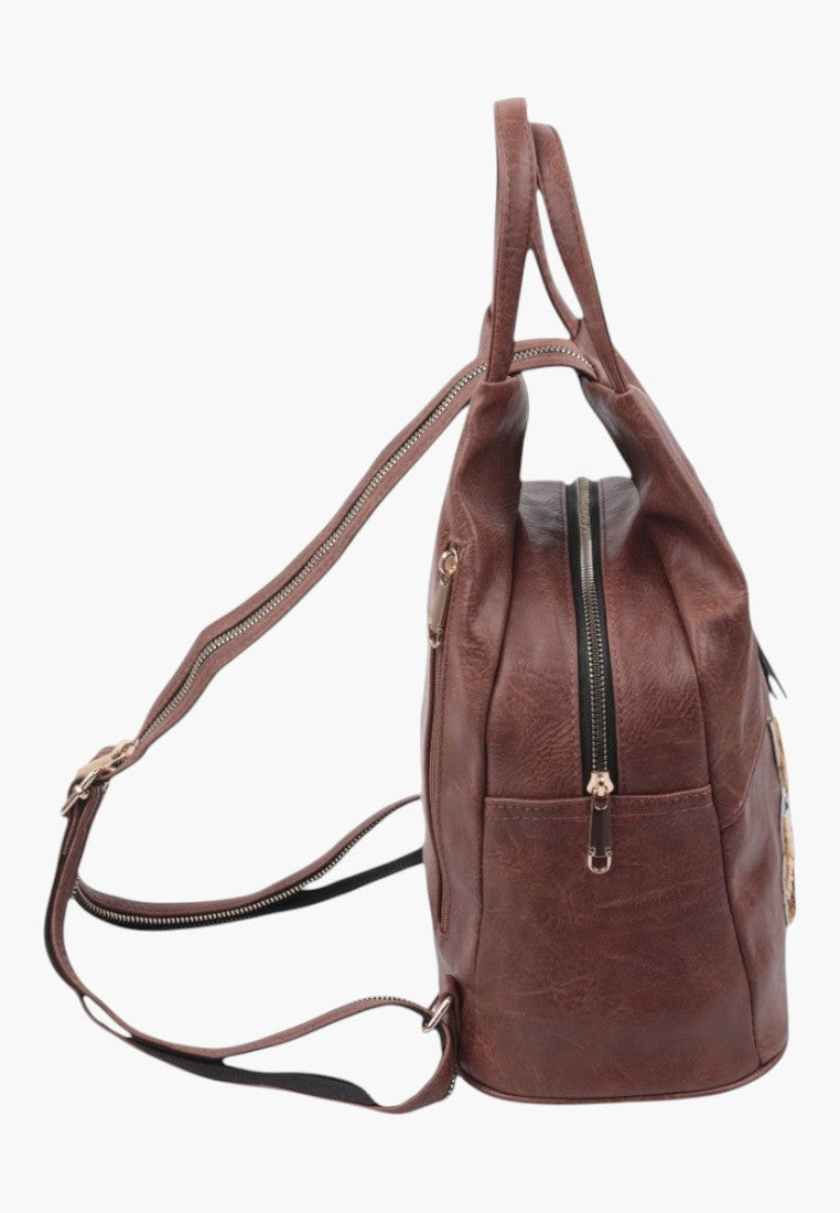 Falio brown faux leather urban backpack with side view showing adjustable straps and gold-tone zipper details