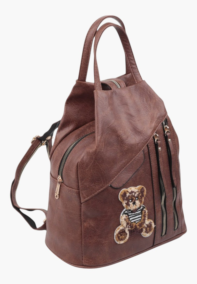 Falio brown faux leather urban backpack with a cute teddy bear patch and multiple zippered pockets