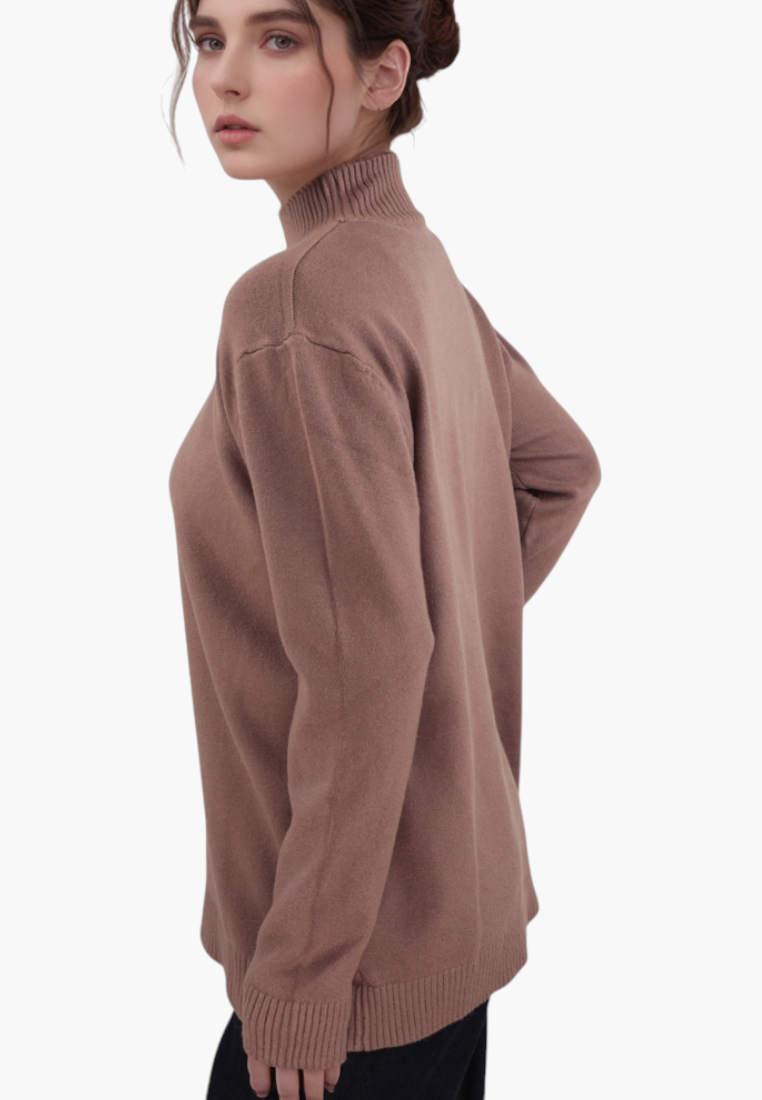 Falio brown long-sleeve mock neck sweater in a soft viscose blend, worn by a model in a side profile view.