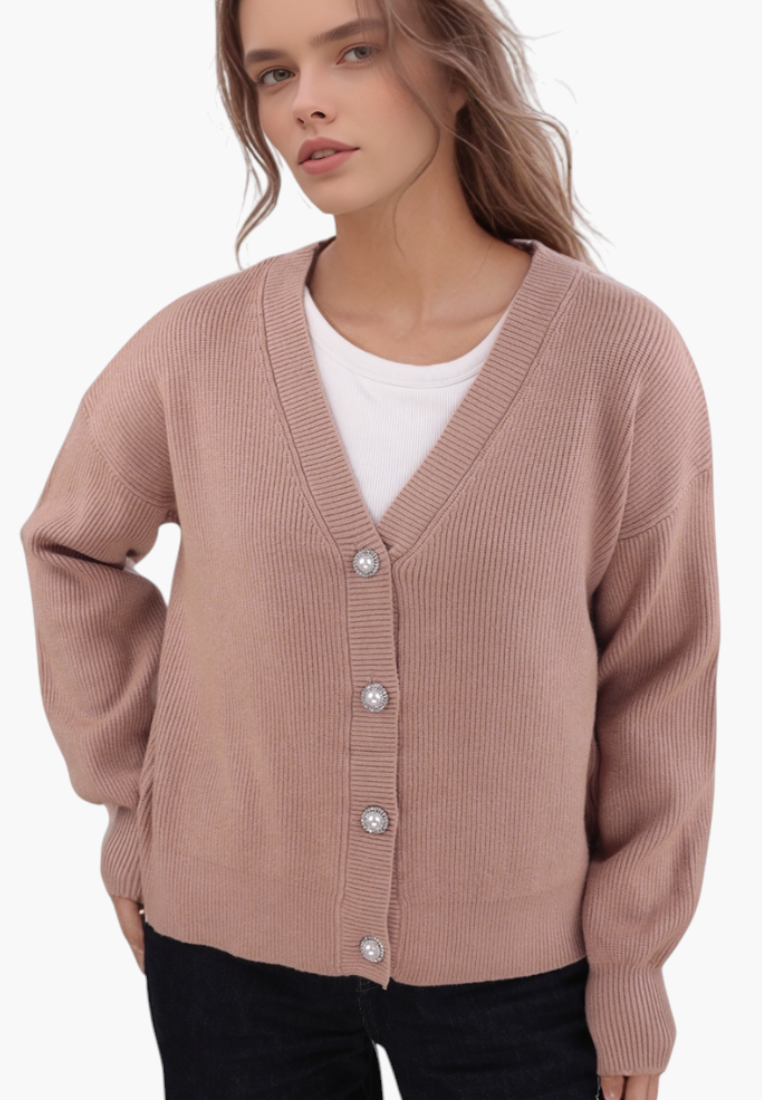 Model wearing a Falio brown V-neck button-down viscose cardigan with ribbed texture over a white top