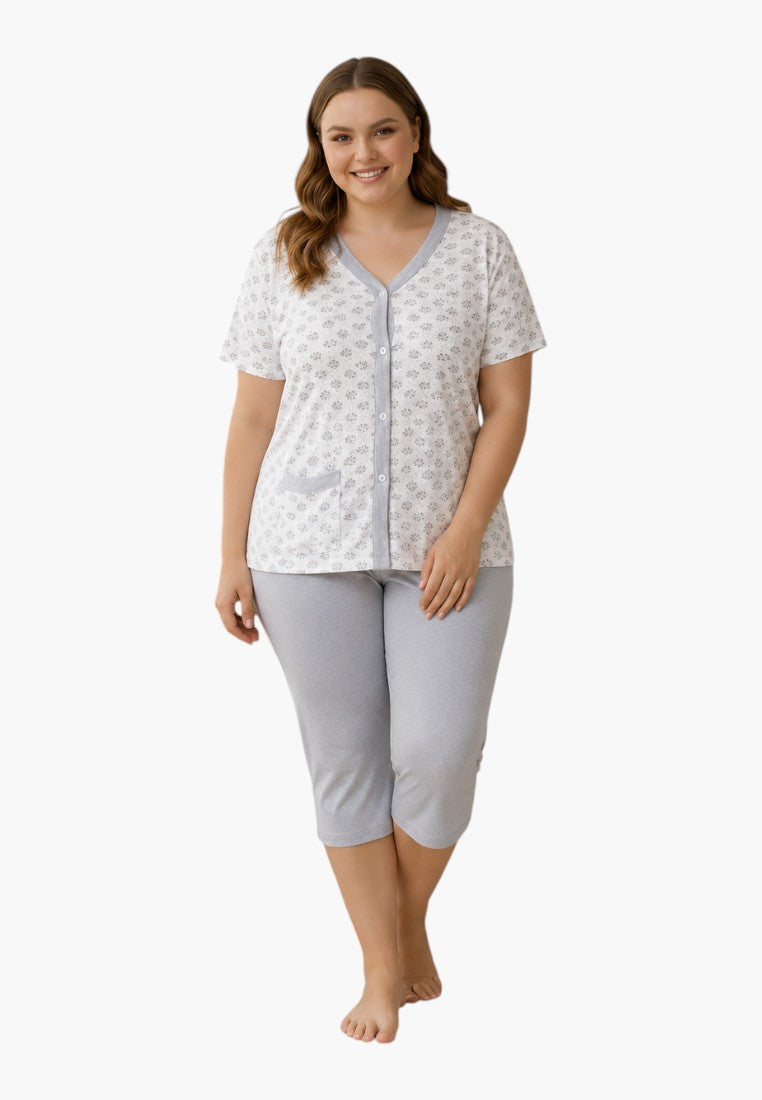 Falio cotton pajama set with a floral print top and grey capri pants worn by a smiling woman