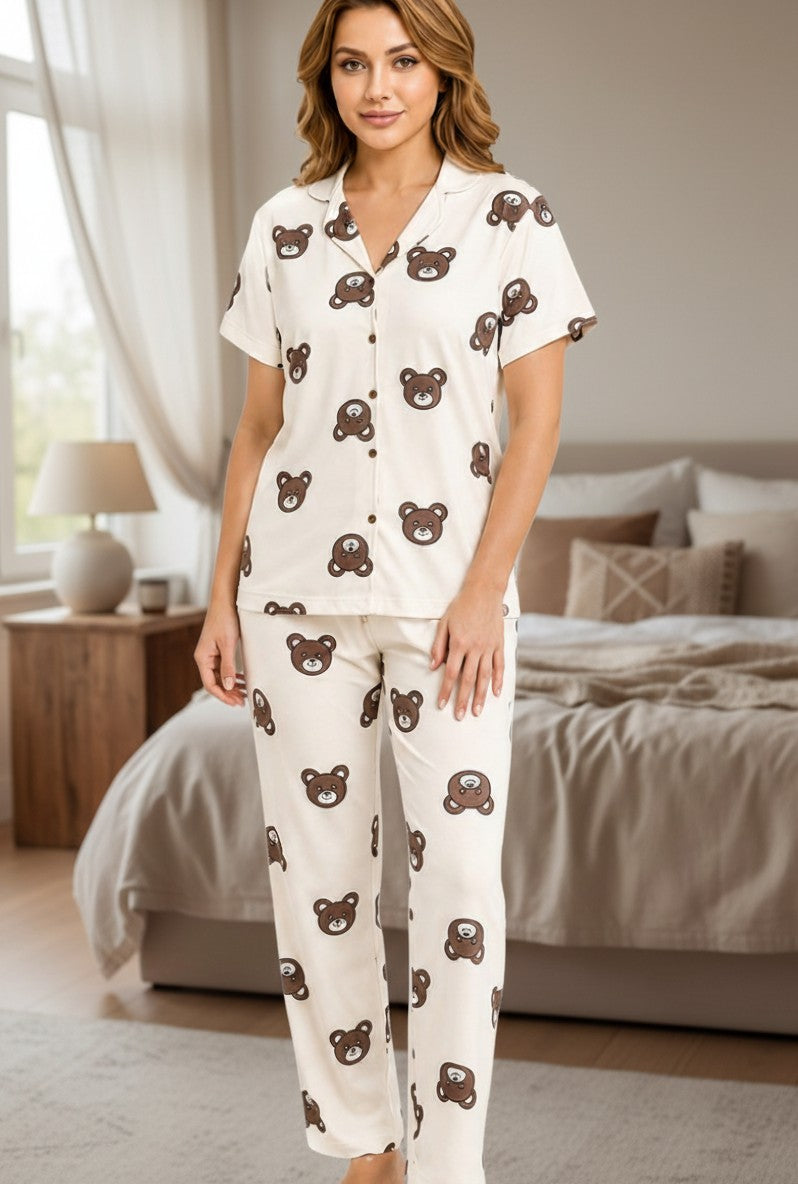 Falio women's cotton pajama set in cream with a brown teddy bear print, featuring a button-down top and long pants.