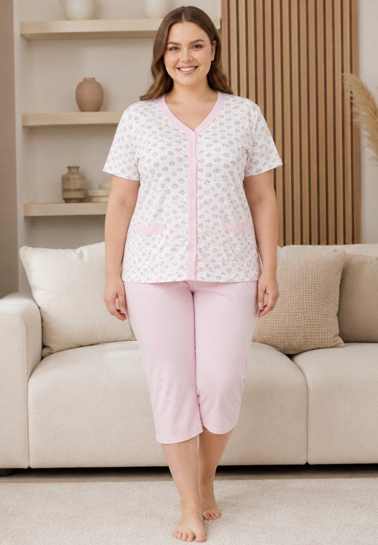 Falio women's 100% cotton pajama set with a floral button-down top and light pink capri pants on a smiling model.
