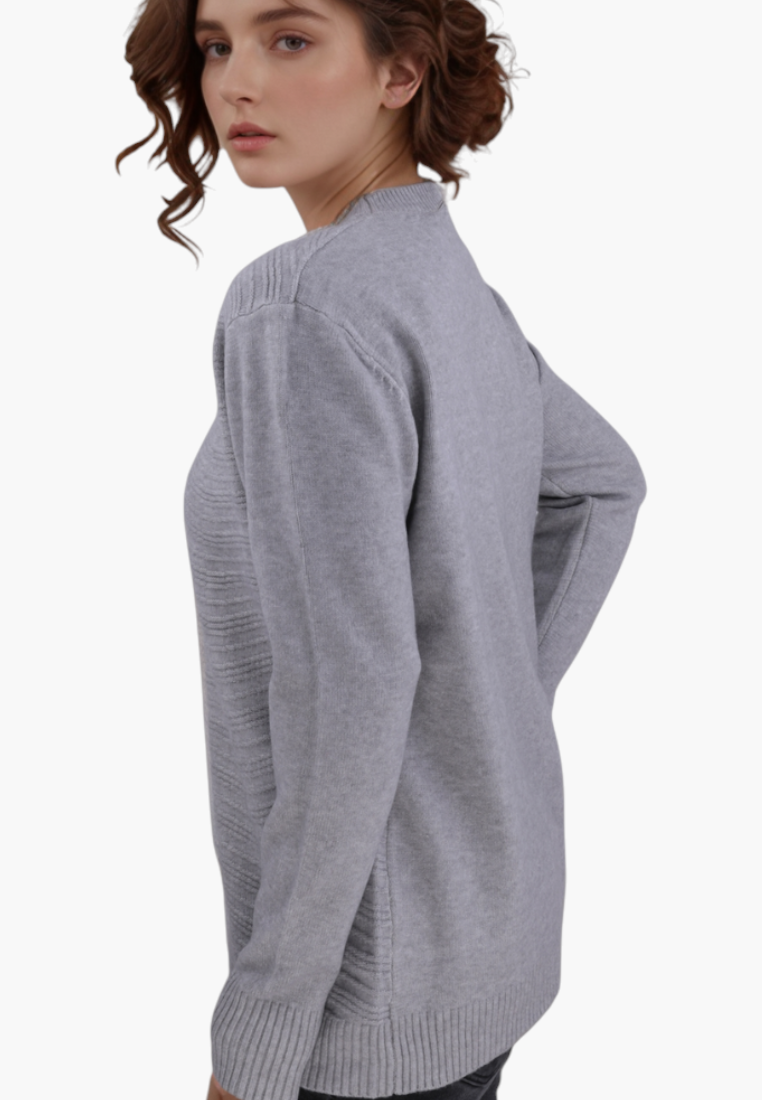 Model wearing a Falio grey cashmere blend sweater with a round neckline and long sleeves, side view