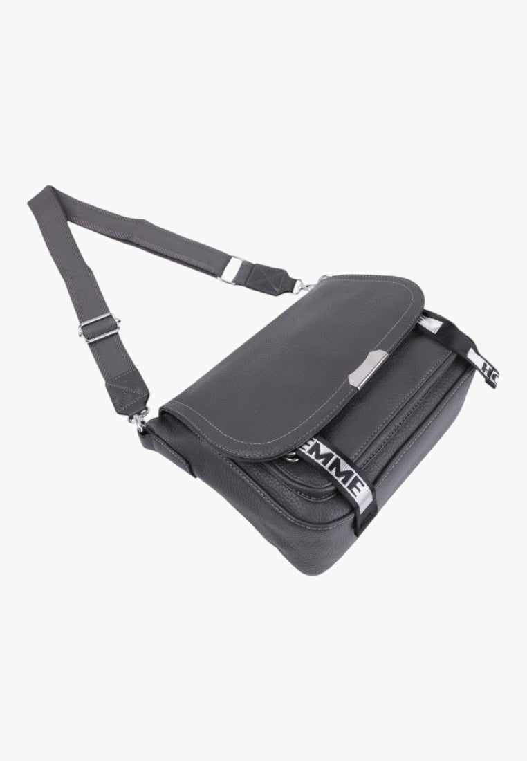 Falio grey faux leather crossbody bag with a flap closure, adjustable shoulder strap, and branded ribbon detail.