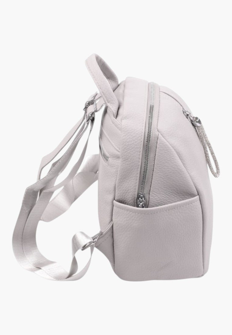 Falio grey urban faux leather backpack with side pockets and silver zipper details, side view