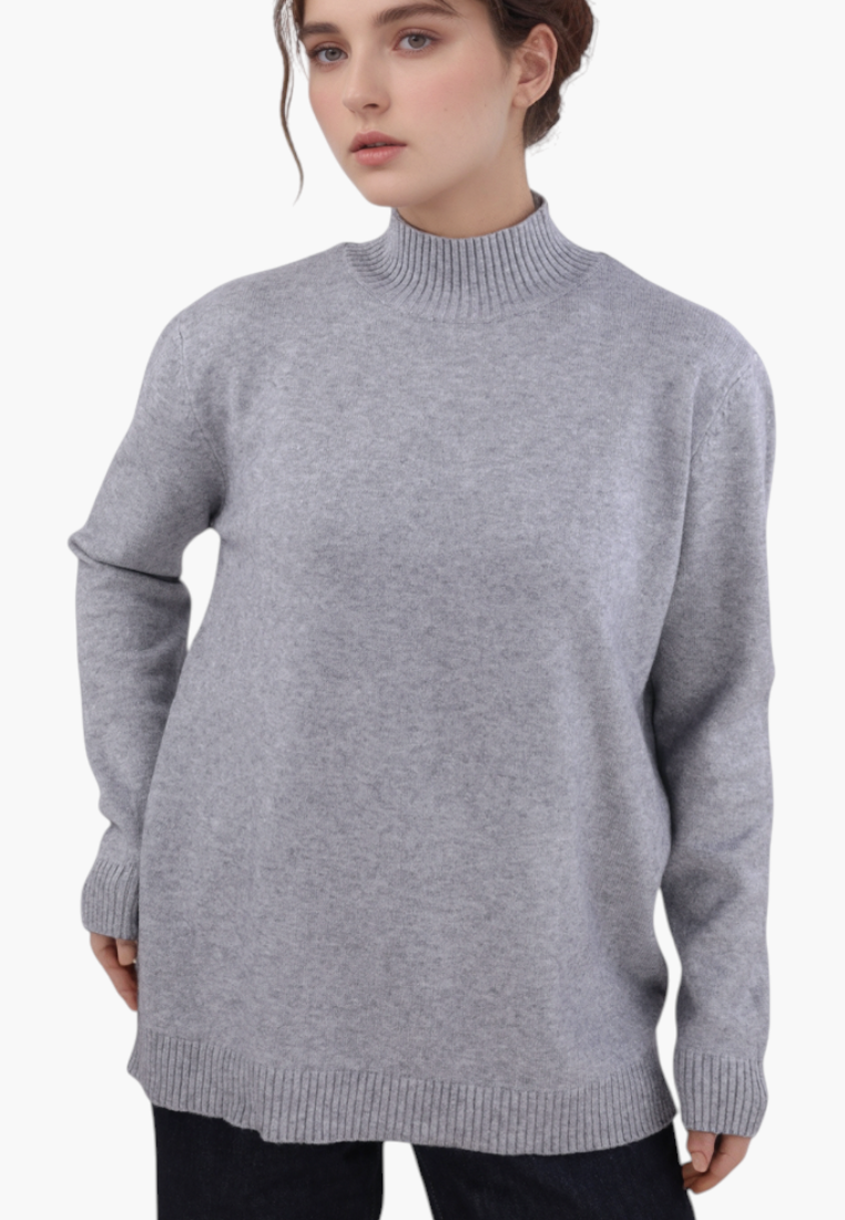 Falio grey plus size mock neck sweater with long sleeves worn by a model against a white background
