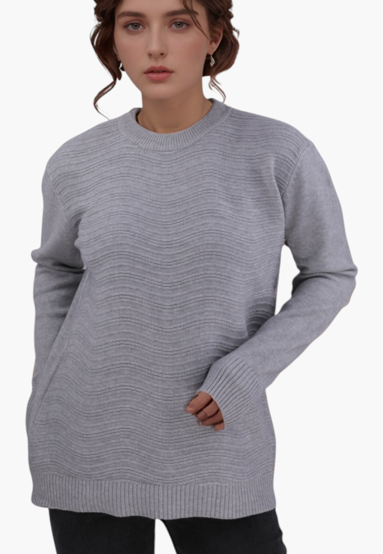 Model wearing a Falio grey long-sleeve sweater with a textured wavy knit pattern and round neckline.