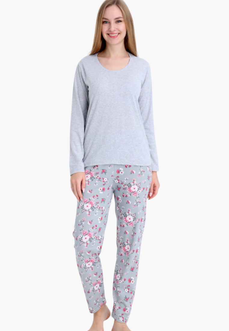 Falio women's insulated cotton pajama set with a grey long-sleeve top and floral print trousers on a smiling model.