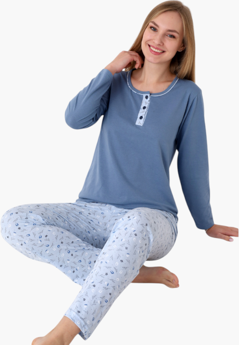 Falio women's insulated cotton pajama set with a blue long-sleeve top and patterned trousers, worn by a smiling model