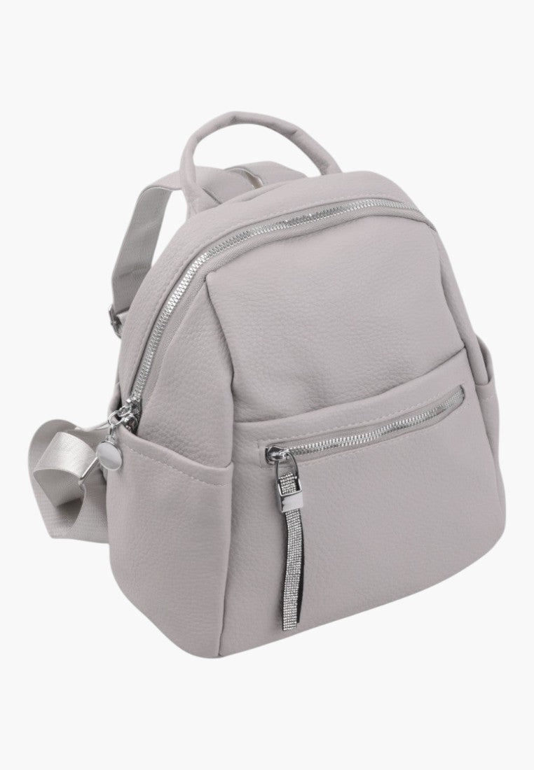 Falio compact urban backpack in light grey faux leather with silver zippers and decorative rhinestone pull tabs