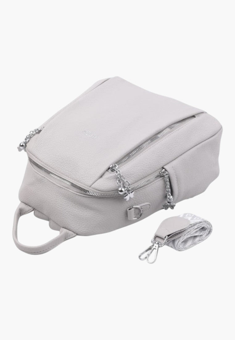 Falio light grey faux leather urban backpack with silver zippers, multiple pockets, and a detachable patterned strap.