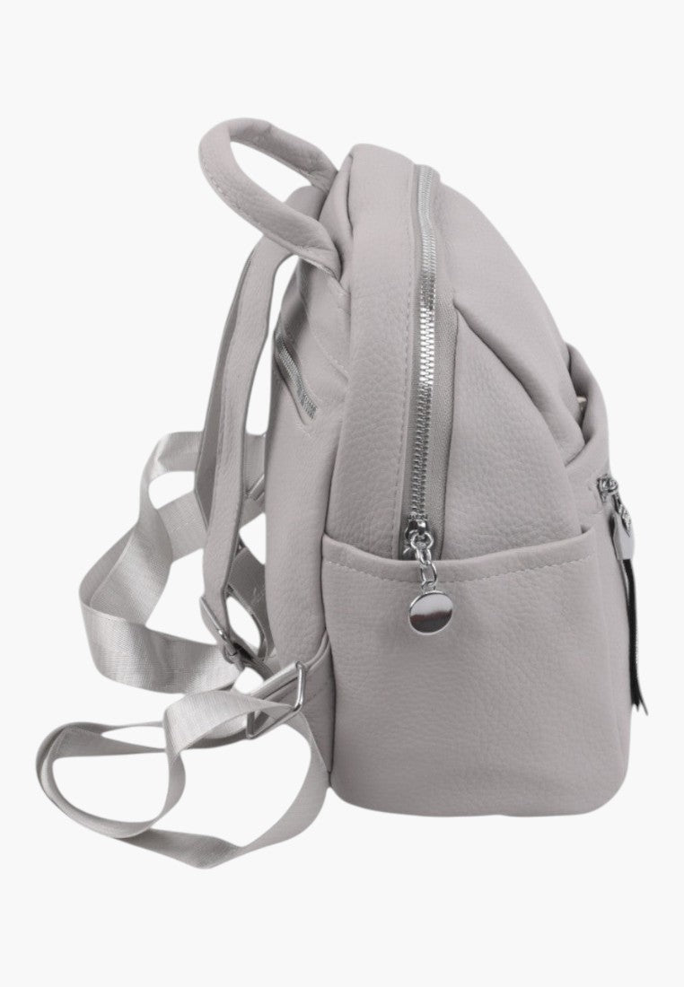 Falio urban women's backpack in light grey faux leather with silver zippers and adjustable straps, side view